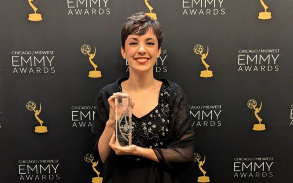 Loyola Chicago DMST student at SOC, MArina Hart Donahue, smiling with her NATAS Midwest America Chicago Crystal Pillar Award